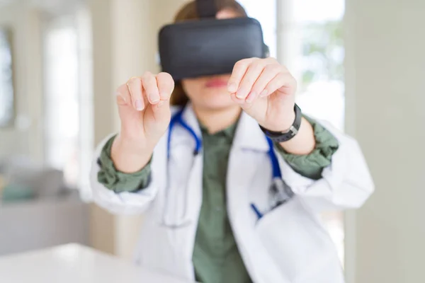 Doctor woman doing surgery simulation using virtual reality glas