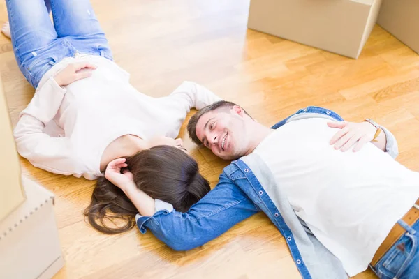 Young Beautiful Couple Relaxing Lying Floor Cardboard Boxes Home Smiling — Stock Photo, Image