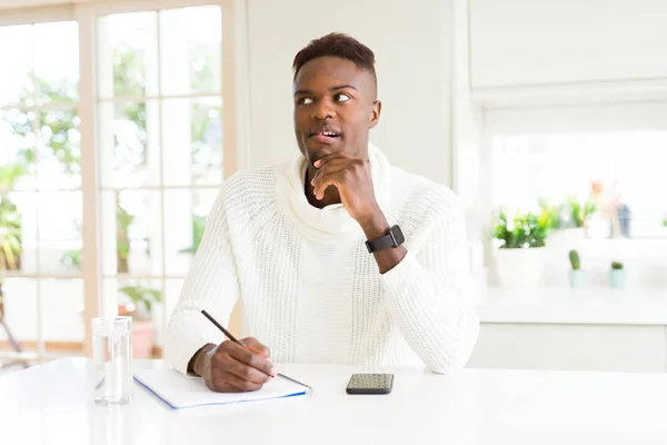 African American Student Man Writing Paper Using Pencil Serious Face — Stock Photo, Image