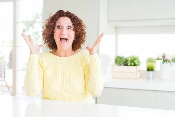 Beautiful Senior Woman Wearing Yellow Sweater Celebrating Crazy Amazed Success — Stock Photo, Image