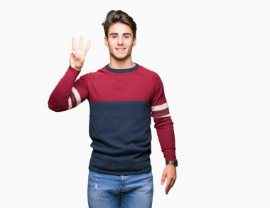 Yakışıklı delikanlı gösterilen ve parmakları ile işaret izole arka plan üzerinde üçüncü ise kendinden emin ve mutlu gülümseyerek.