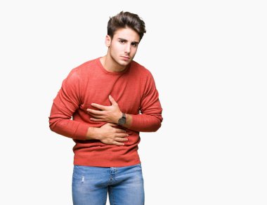 Genç yakışıklı adam izole mide üzerinde el ile arka plan çünkü hazımsızlık, ağrılı hastalık hasta hissediyor. Ağrısı kavramı.