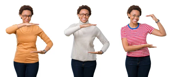 年轻的非洲裔美国女人 头戴非洲式眼镜 手拿着大号和大号的标志 象征着什么 笑着看着摄像机 计量概念 — 图库照片