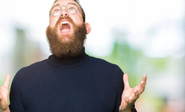Young Blond Man Wearing Glasses Turtleneck Sweater Crazy Mad Shouting — Stock Photo, Image