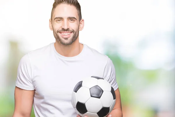 Joven Sosteniendo Pelota Fútbol Sobre Fondo Aislado Con Una Cara — Foto de Stock