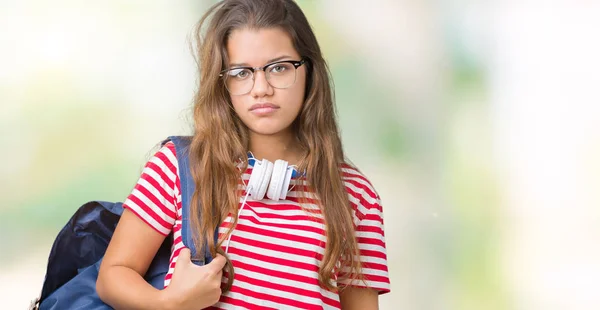 Joven Hermosa Estudiante Morena Con Auriculares Mochila Sobre Fondo Aislado —  Fotos de Stock