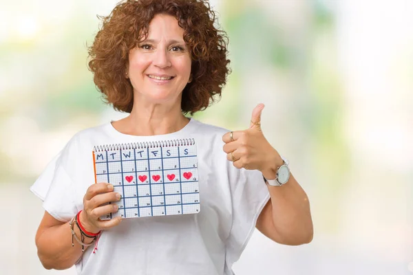 Middle Ager Senior Woman Holding Menstruation Calendar Isolated Background Happy — Stock Photo, Image