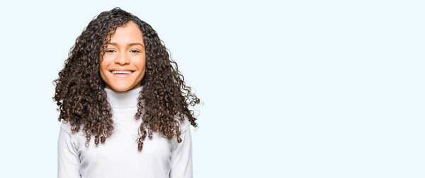 Young beautiful woman with curly hair wearing turtleneck sweater with a happy and cool smile on face. Lucky person.