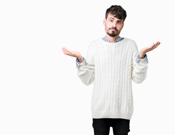 Junger Gutaussehender Mann Mit Winterpullover Über Isoliertem Hintergrund Ratloser Und — Stockfoto