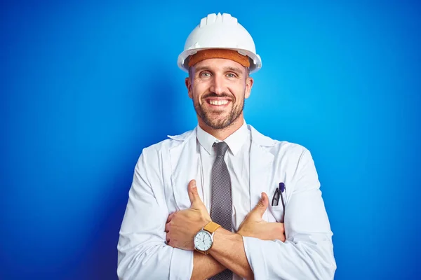 Young Handsome Engineer Man Wearing Safety Helmet Blue Isolated Background — 스톡 사진