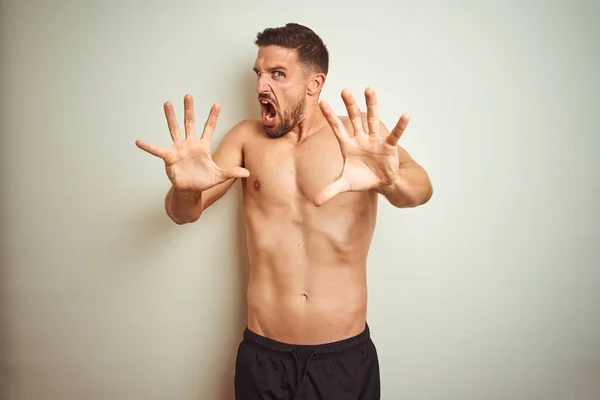 Young Handsome Shirtless Man Isolated Background Afraid Terrified Fear Expression — 图库照片