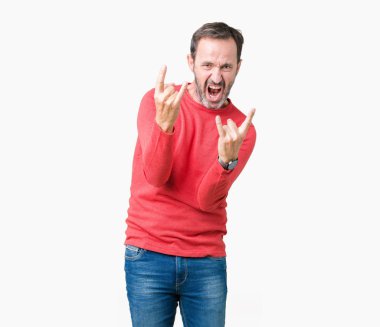 Deli ifade rock simge elle yapıyor ile bağırarak izole arka plan üzerinde kış kazak giymiş yakışıklı orta yaş ağarmış komuta sizde. Müzik yıldızı. Ağır kavramı.