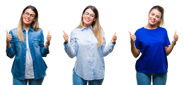 高声的年轻女子戴着眼镜在孤立的背景成功标志做积极的姿态与手 竖起大拇指微笑和快乐 看着相机欢快的表情 胜利者的手势 — 图库照片