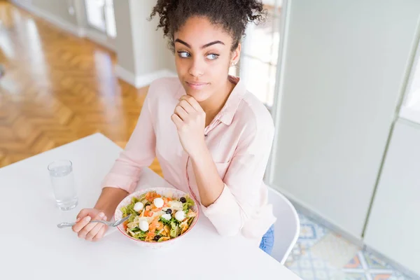 Young African American Woman Eating Healthy Pasta Salad Serious Face — Stock Photo, Image