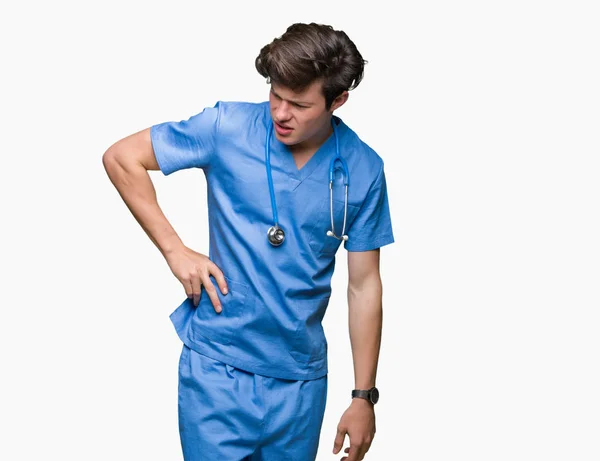 Ung Läkare Som Bär Medicinsk Uniform Över Isolerad Bakgrund Lidande — Stockfoto