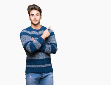 Yakışıklı delikanlı izole üzerinden reklam, ciddi ve sakin yüz gösterilen yan el parmak ile işaret arka plan