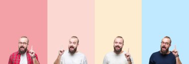 Renkli çizgiler üzerinde sakal ile genç adam kolaj başarılı bir fikir ile parmak yukarı işaret izole arka plan. Çıkıldı ve mutlu. Bir numara.