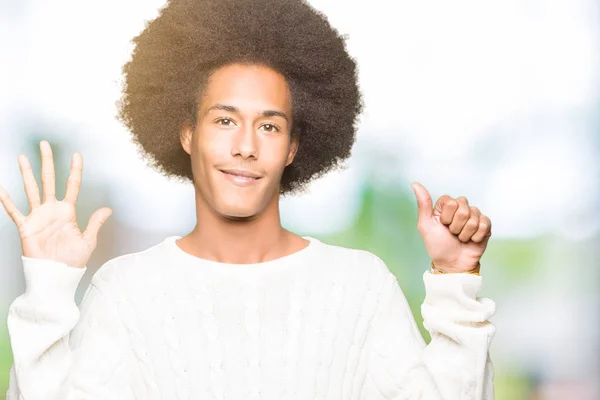 Young African American Man Afro Hair Wearing Winter Sweater Showing — Stock Photo, Image