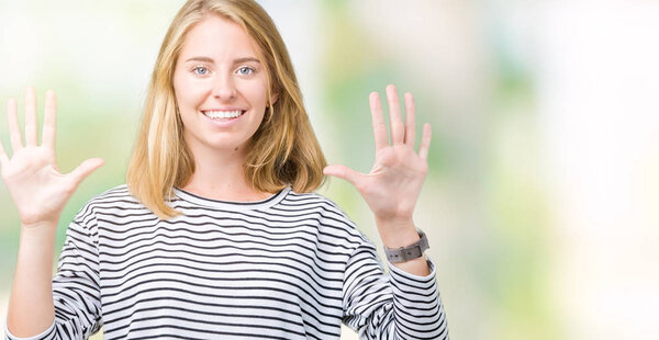 Beautiful young woman wearing stripes sweater over isolated background showing and pointing up with fingers number ten while smiling confident and happy.