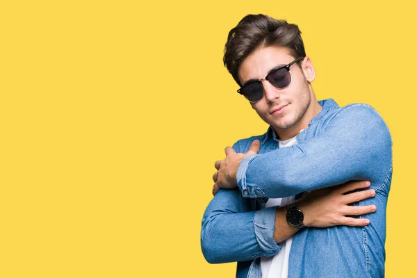 Young Handsome Man Wearing Sunglasses Isolated Background Hugging Oneself Happy — Stock Photo, Image