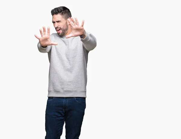 Jovem Homem Bonito Vestindo Camisola Sobre Fundo Isolado Com Medo — Fotografia de Stock