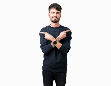 Yakışıklı delikanlı izole arka plan üzerinde işaretleme için her iki parmak, farklı yönde ile katılmıyorum