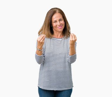 Giyen güzel orta yaş kadın kazak izole arka plan yapıyor para hareketi el ile üzerinden maaş ödeme için milyoner iş soran çizgili