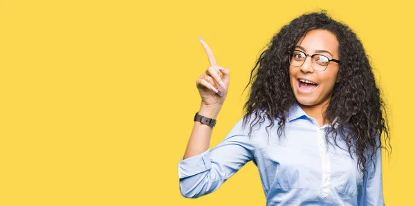 Young Beautiful Business Girl Curly Hair Wearing Glasses Pointing Finger — Stock Photo, Image