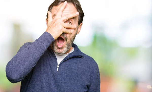 Middle Age Handsome Man Wearing Sweater Peeking Shock Covering Face — Stock Photo, Image