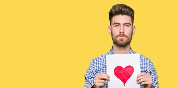 Young Handsome Man Holding Paper Red Heart Confident Expression Smart — Stock Photo, Image