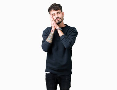 Yakışıklı delikanlı uyku yorgun hayal ve ellerle birlikte poz ile kapalı gözler gülümseyen izole arka plan üzerinde.