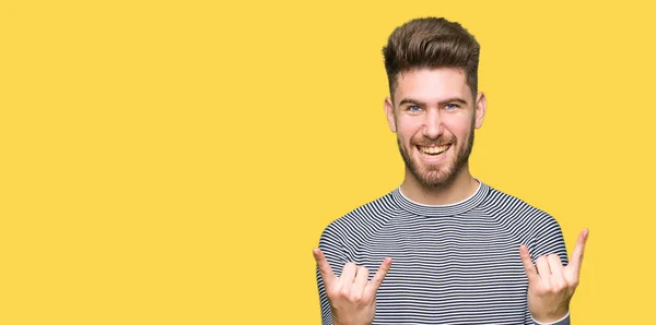 Young Handsome Man Wearing Stripes Sweater Shouting Crazy Expression Doing — Stock Photo, Image