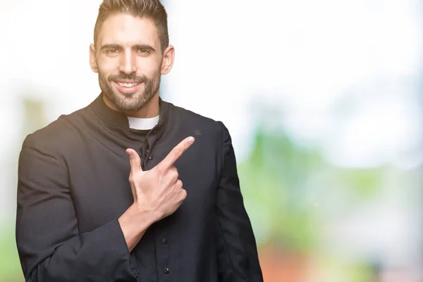 Young Christian Priest Isolated Background Cheerful Smile Face Pointing Hand — Stock Photo, Image