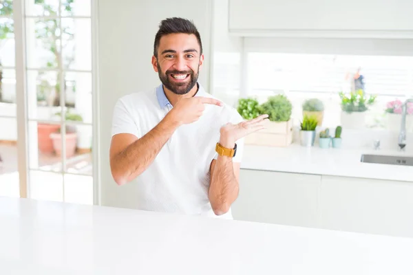 Handsome Hispanic Man Casual White Shirt Home Amazed Smiling Camera — Stock Photo, Image