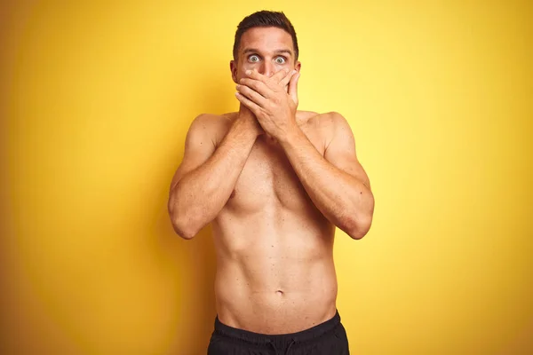 Young Handsome Shirtless Man Isolated Yellow Background Shocked Covering Mouth — Stock Photo, Image