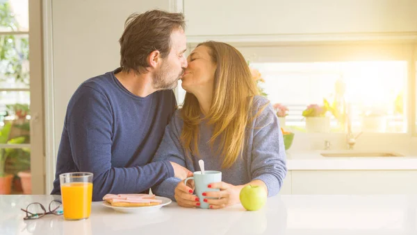 Beautiful romantic middle age couple kissing having healthy brea — Stock Photo, Image