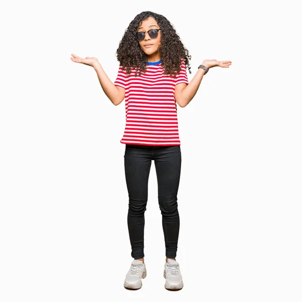 Young Beautiful Woman Curly Hair Wearing Sunglasses Clueless Confused Expression — Stock Photo, Image