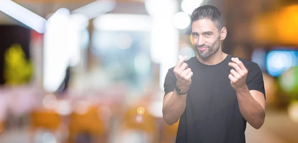 Joven Hombre Guapo Sobre Fondo Aislado Haciendo Gesto Dinero Con — Foto de Stock