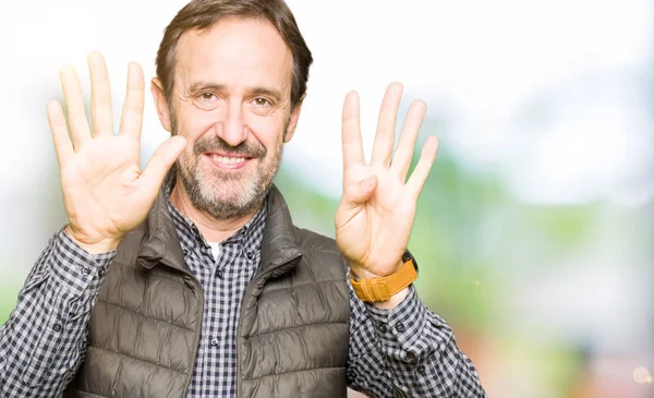 Homem Bonito Meia Idade Vestindo Colete Inverno Mostrando Apontando Para — Fotografia de Stock