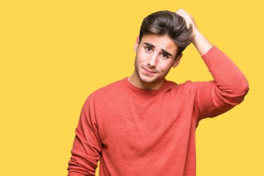 Yakışıklı delikanlı izole arka plan üzerinde yanıltır ve soru hakkında merak ediyorum. Şüphe, kafasına el ile düşünme ile belirsiz. Dalgın kavramı.