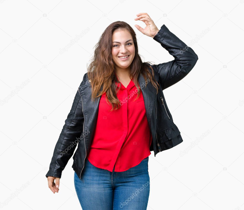 Beautiful plus size young woman wearing a fashion leather jacket over isolated background Dancing happy and cheerful, smiling moving casual and confident listening to music