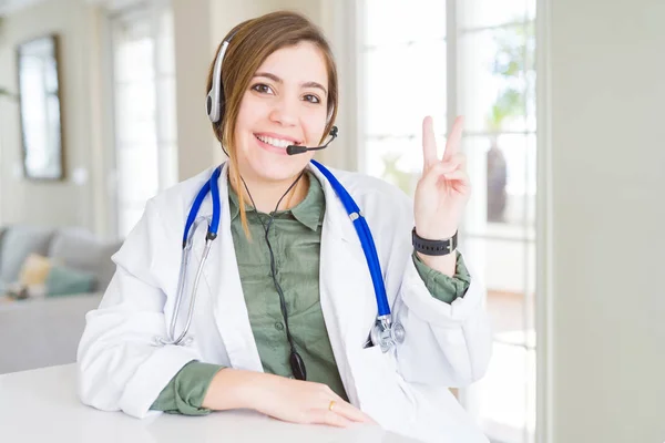 Beautiful Young Doctor Woman Wearing Headset Smiling Happy Face Winking — Stock Photo, Image