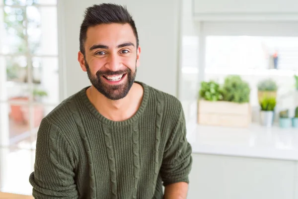 Handsome man smiling cheerful with a big smile on face showing teeth, positive and happy expression