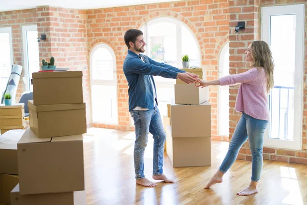 Young Couple Dancing Celebrating Moving New Apartment Cardboard Boxes — Stock Photo, Image