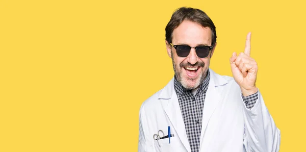 Handsome Middle Age Doctor Man Wearing Sunglasses Pointing Finger Successful — Stock Photo, Image
