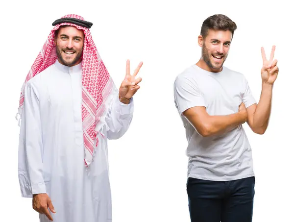 勝利のサインをしているカメラで幸せそうな顔で微笑む孤立した背景の上にハンサムな若者とアラブ人のコラージュ ナンバー2 — ストック写真