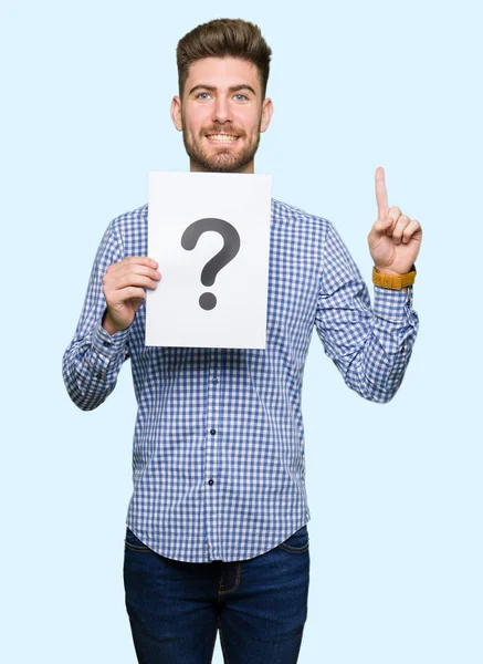 Young Handsome Man Holding Paper Question Mark Surprised Idea Question — Stock Photo, Image