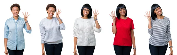非洲裔美国妇女与非洲头发在孤立的背景显示和指向与手指四 同时微笑着自信和快乐 — 图库照片