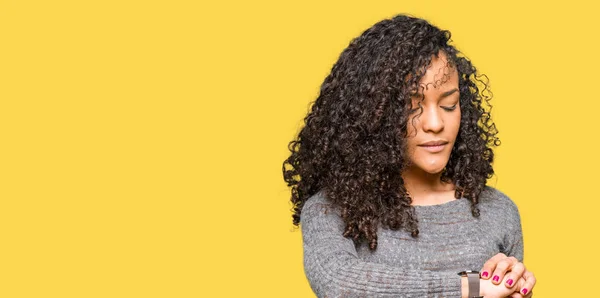 Young Beautiful Woman Curly Hair Wearing Grey Sweater Checking Time — Stock Photo, Image