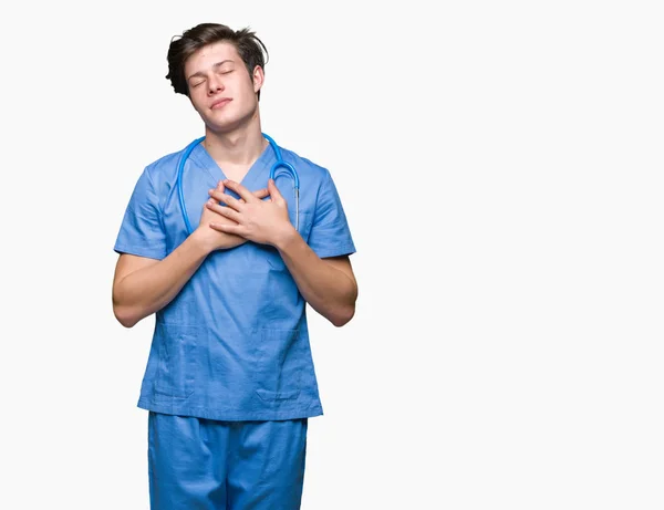 Joven Doctor Vistiendo Uniforme Médico Sobre Fondo Aislado Sonriendo Con — Foto de Stock